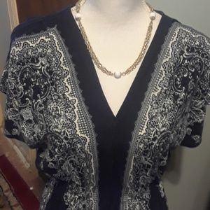 Black dress with white floral pattern, size M